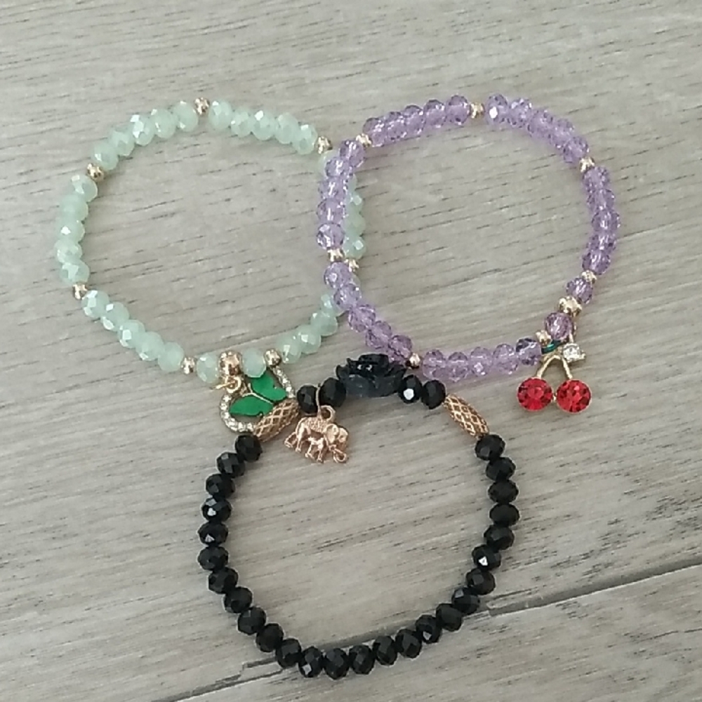 Set of Three Beaded Bracelets with Charms